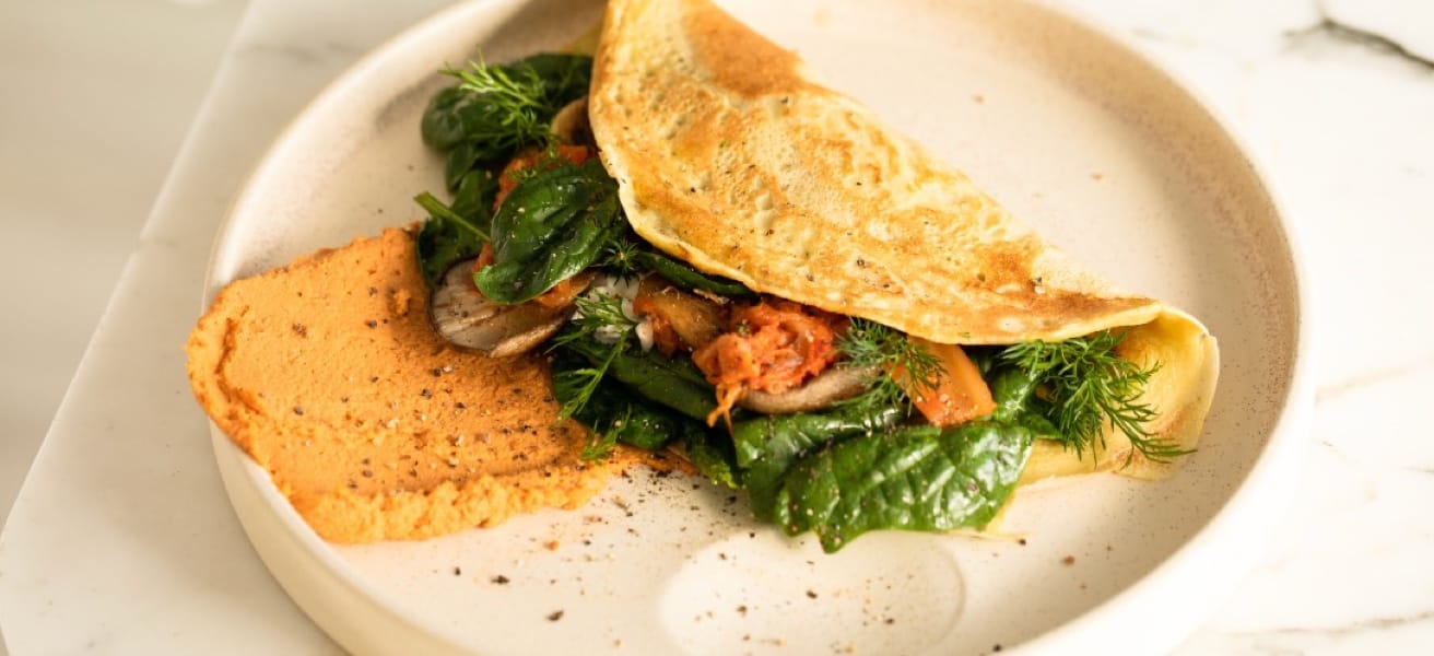 a omelette with greens in a plate